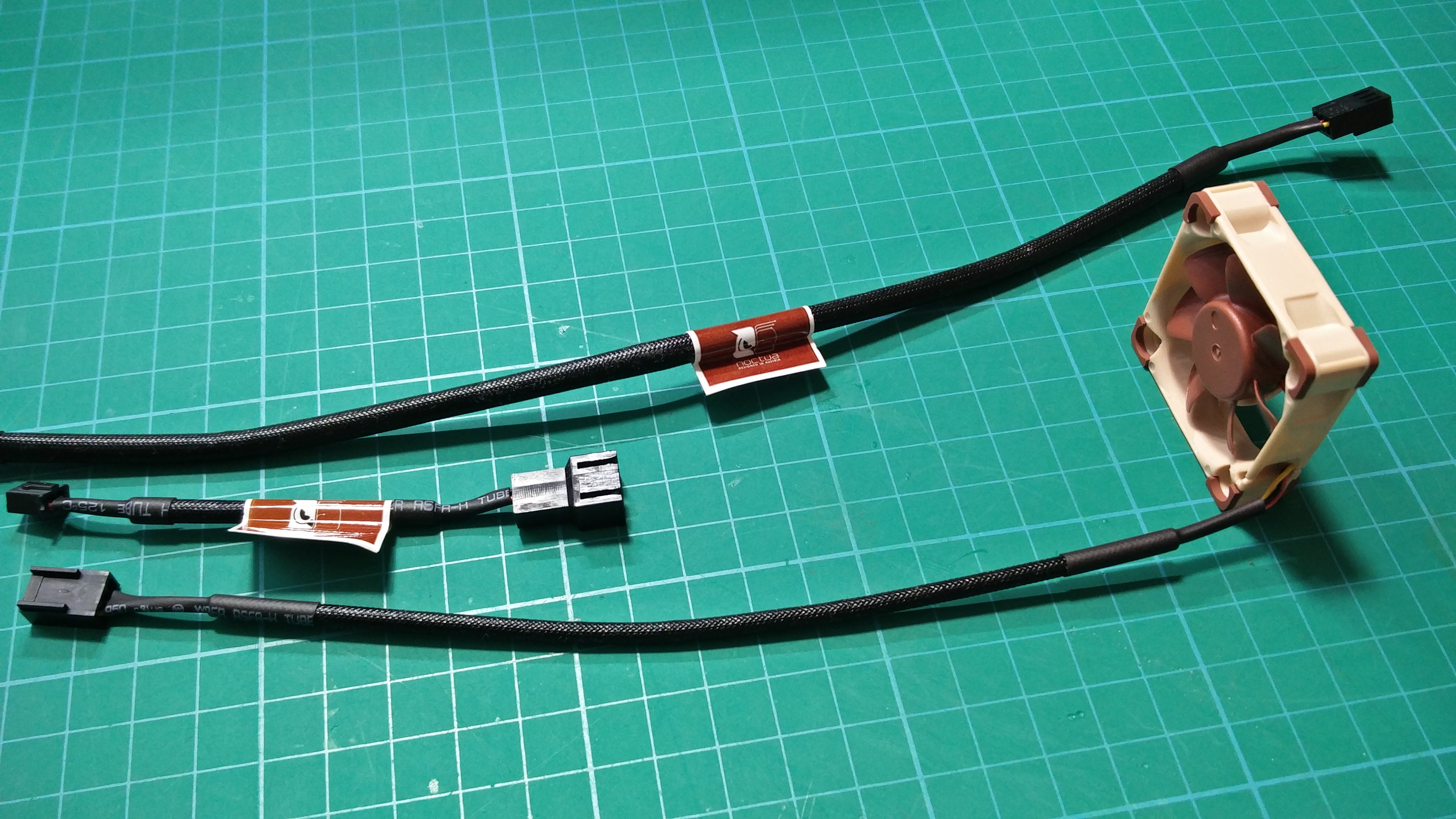 The fan wires are covered in a stiff sheathing.